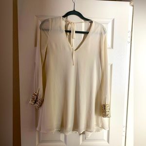 Long sleeve sheer white short dress with gold cuffs